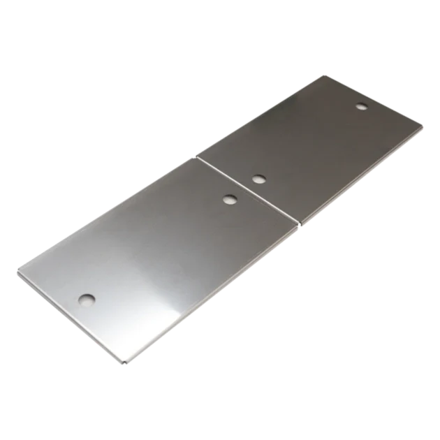 Two metallic plates with holes on a white background