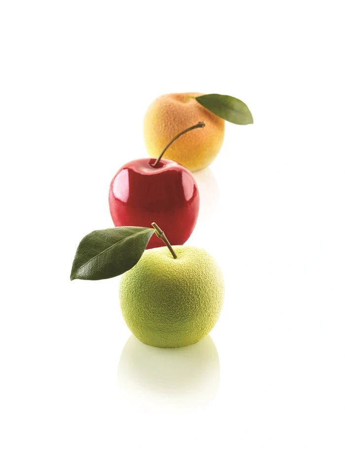 Three pastry apples in different colors on a white background.