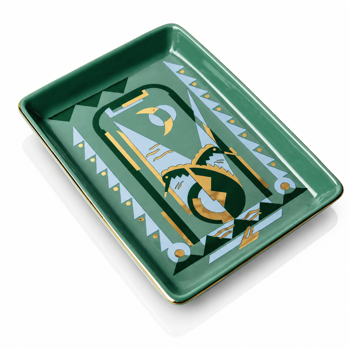 A rectangular green ceramic tray with a gold and white geometric art-deco style design on the inside, shown on a white background.