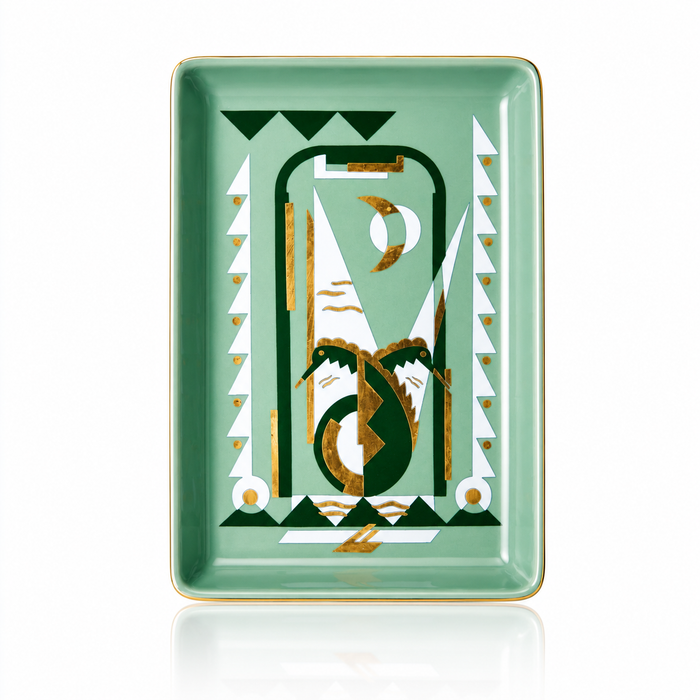 A rectangular ceramic tray with rounded corners, featuring a mint green background and a central abstract geometric design in dark green, white, and gold. The design includes stylized arches, triangles, and crescent moon motifs.