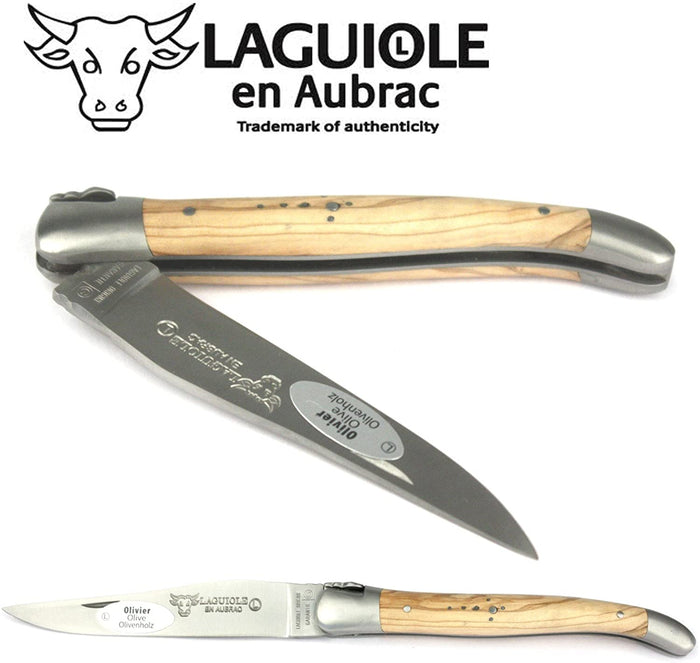 Close view of the blade folding into the olive wood handle