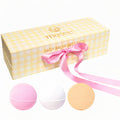 Musee Gingham Three Balm Set with pink, white, and peach bath balms in yellow checkered gift box