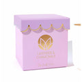 MUSEE Lavender & Chamomile scalloped soy candle in pink packaging with gold accents