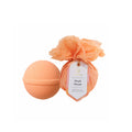 MUSEE Peach Dream bath balm sphere in peachy-orange with organza packaging and label tag