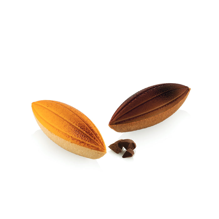 Two almonds shaped pastries and a single almond seed on a white background.