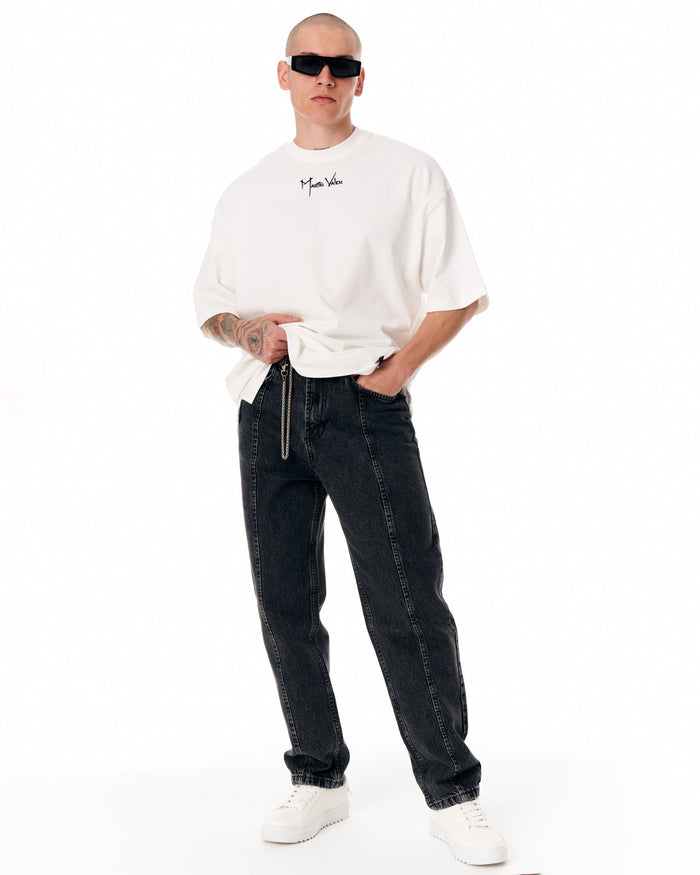 Martin Valen Urban Style washed black jeans, three-quarter front view showing straight fit and silver chain accessory