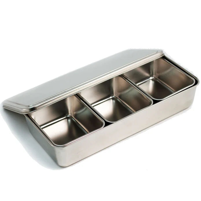 Stainless steel compartmentalized container on a white background